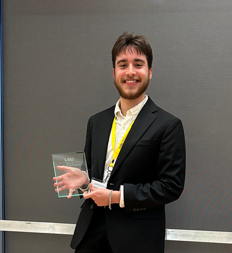 Alexander Parkhurst holding his first place award