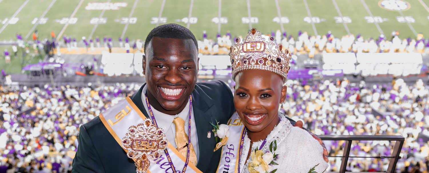Homecoming King and Queen T'Senre Gray and Kalayna Walker pose for a picture in a suite overlooking Tiger Stadium.