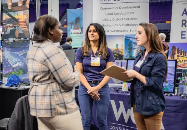 photo of 3 women speaking at a career fair