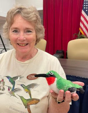 jane patterson holding a plush hummingbird
