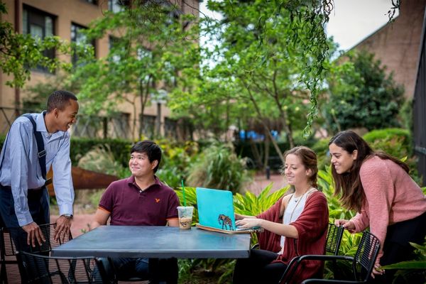 students outside of art and design building