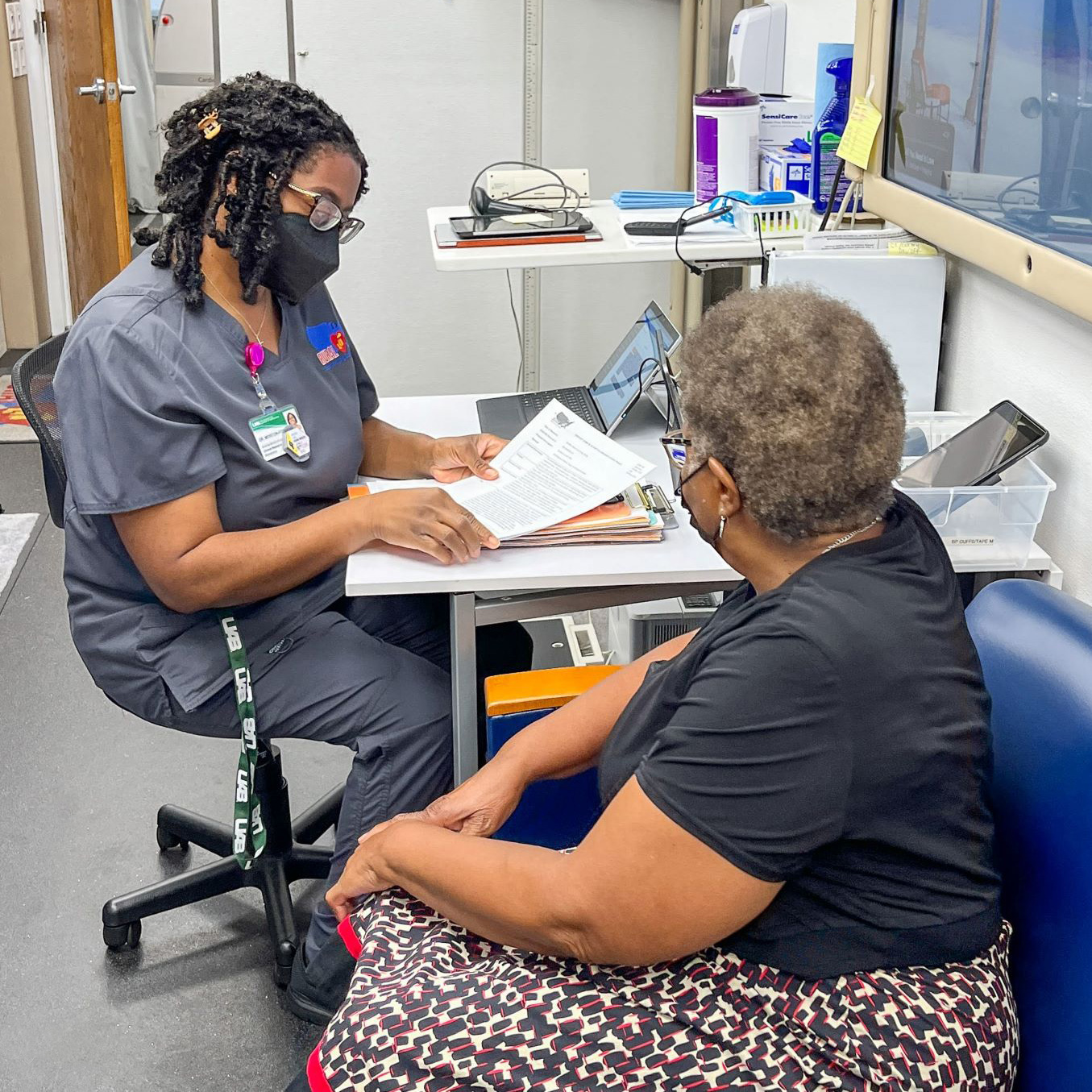 Shelicia Morton-Ford, clinical research nurse coordinator for the RURAL study, goes over informed consent with a RURAL participant. Shelicia Morton-Ford, clinical research nurse coordinator for the RURAL study, goes over informed consent with a RURAL participant.