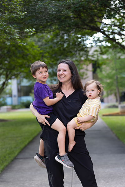 Kristina Haakma holding her son and daughter